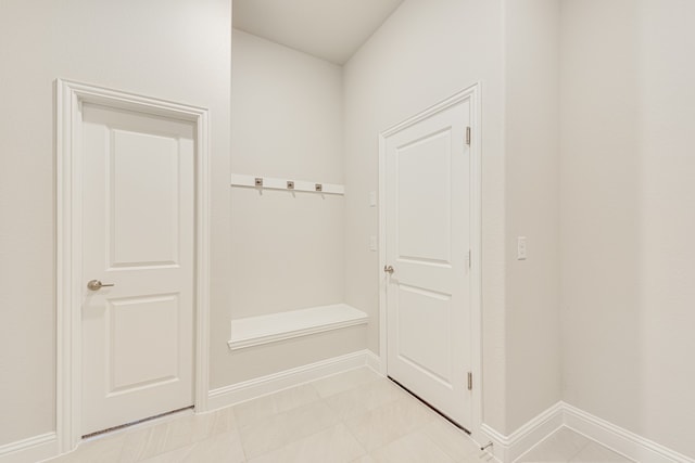 mudroom with light tile patterned floors