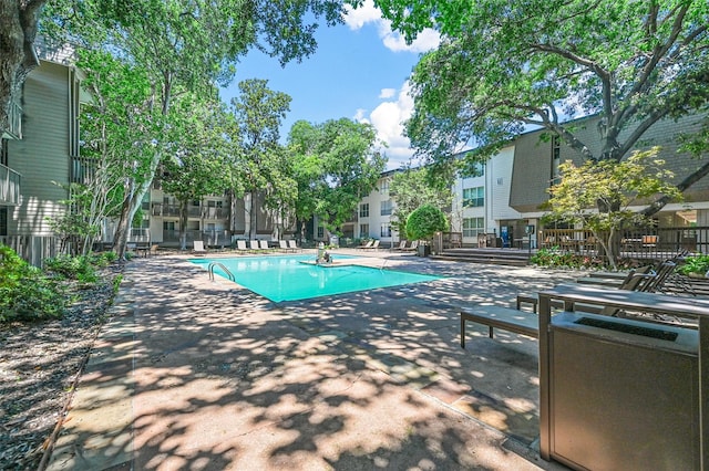 view of swimming pool with a patio