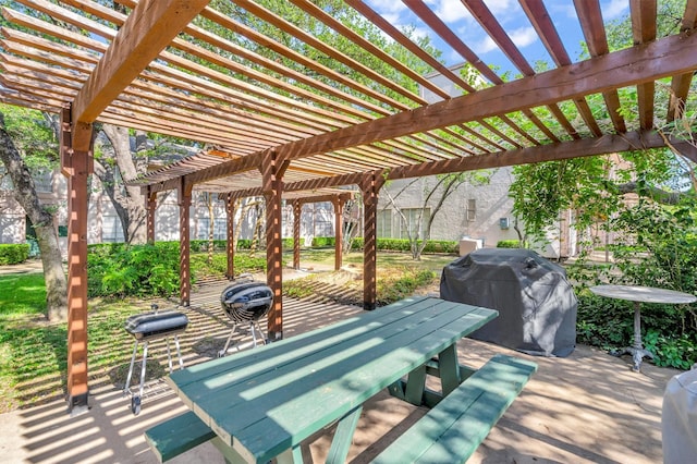 view of patio with a grill and a pergola