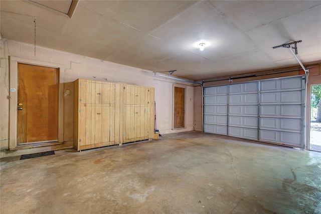 garage with concrete block wall