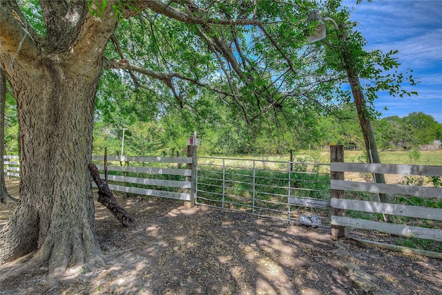 view of gate featuring fence