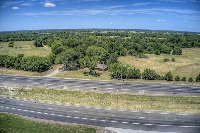 aerial view featuring a wooded view