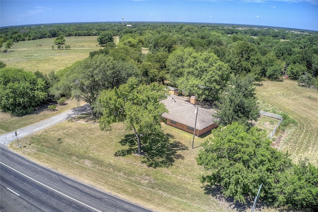 bird's eye view with a rural view and a wooded view