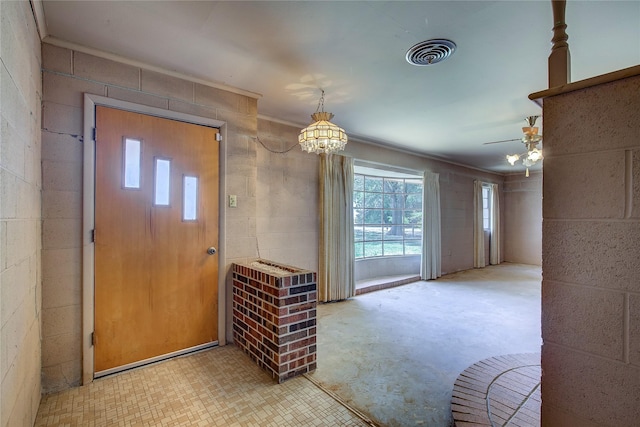 entrance foyer featuring visible vents and concrete block wall