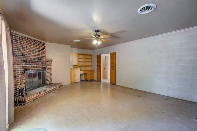 unfurnished living room featuring ceiling fan, a fireplace, visible vents, and tile patterned floors