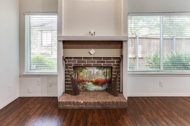 room details featuring a fireplace and hardwood / wood-style flooring