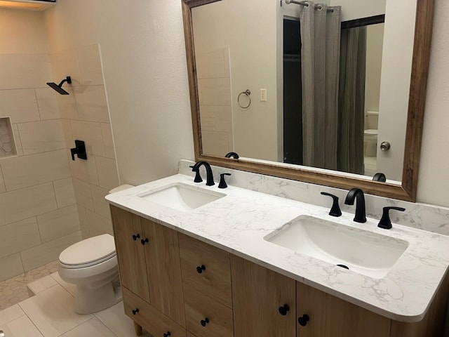 bathroom featuring tile patterned flooring, vanity, toilet, and a shower with shower curtain