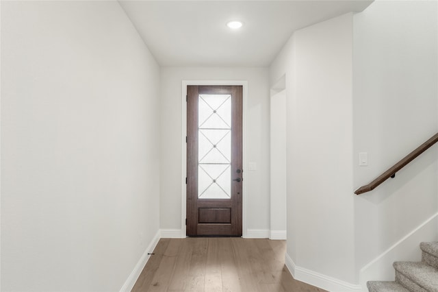 doorway with light hardwood / wood-style floors