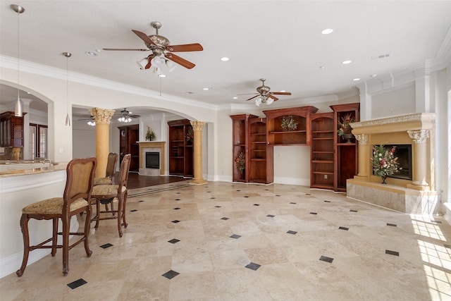 tiled living room featuring ornamental molding and ceiling fan