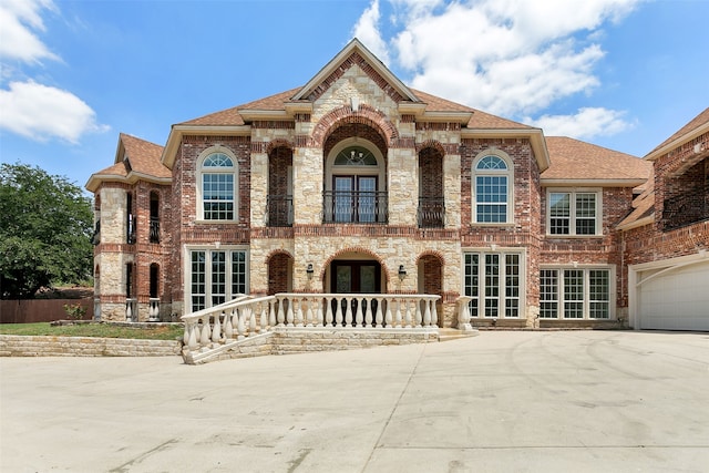 view of front of property featuring a garage and french doors