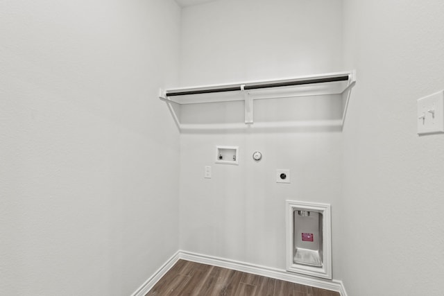 clothes washing area featuring laundry area, gas dryer hookup, dark wood-type flooring, hookup for a washing machine, and hookup for an electric dryer