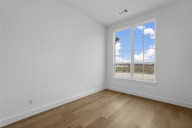 spare room featuring light wood-type flooring