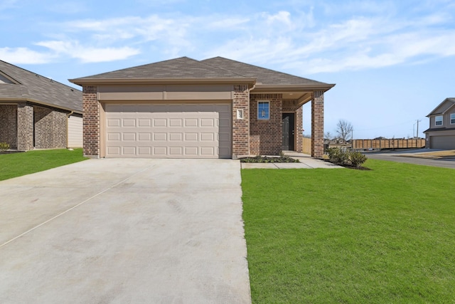 view of front facade with a front yard and a garage