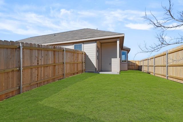 back of house featuring a yard