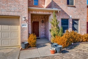 doorway to property featuring a garage