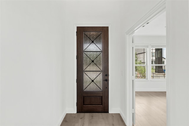 doorway to outside with light hardwood / wood-style floors