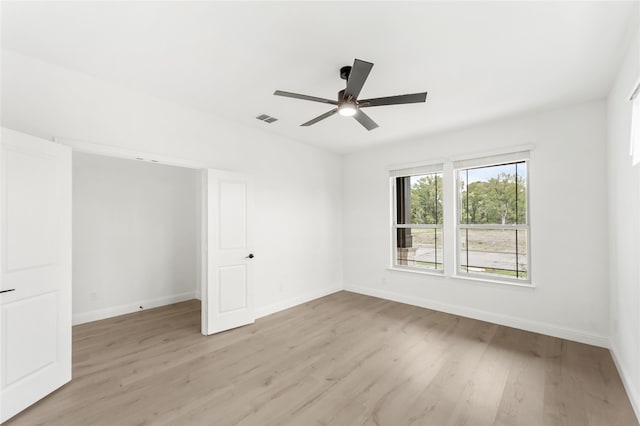 unfurnished room with light hardwood / wood-style flooring and ceiling fan