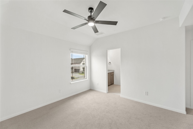 carpeted empty room with ceiling fan and lofted ceiling