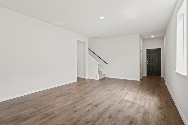 empty room with hardwood / wood-style flooring