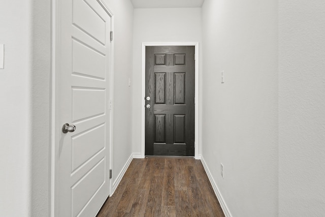 doorway to outside with dark hardwood / wood-style floors