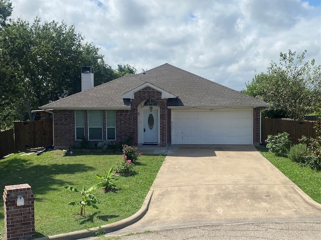 single story home featuring a front lawn and a garage