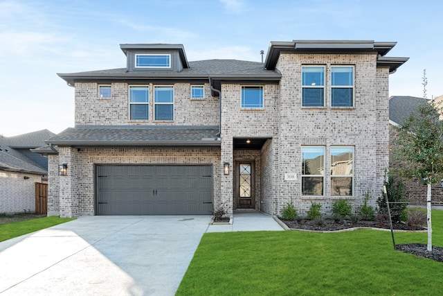 view of front facade featuring a garage and a front lawn