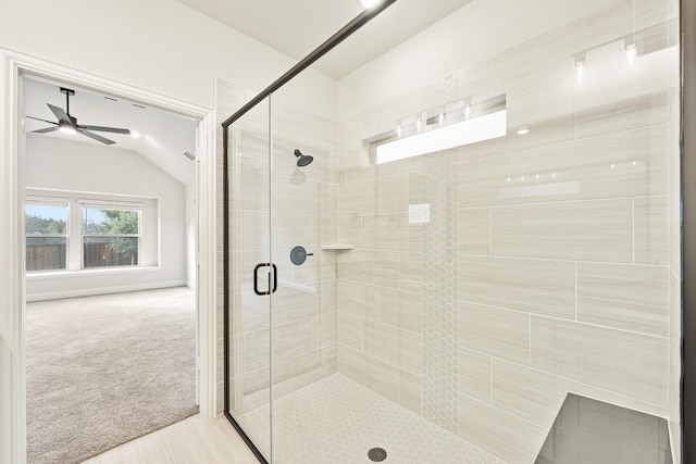 bathroom with ceiling fan and walk in shower