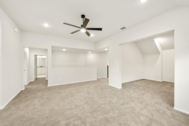 interior space with ceiling fan and light carpet