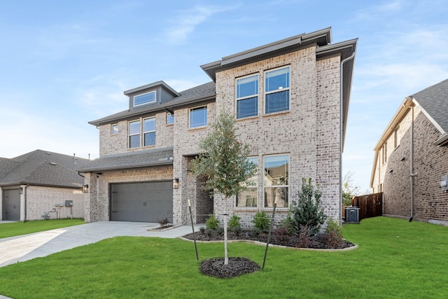 view of front facade featuring a front lawn, central AC unit, and a garage