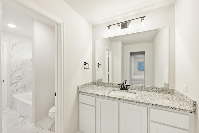 bathroom with vanity and toilet