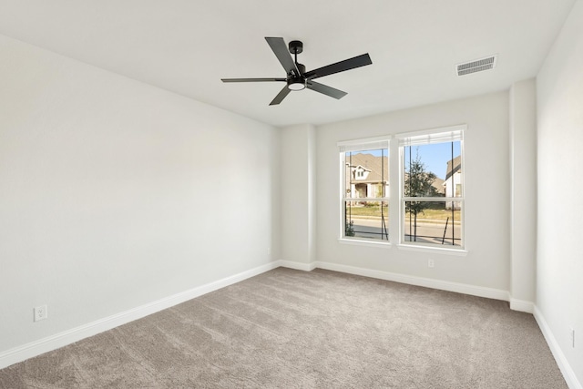 carpeted empty room with ceiling fan