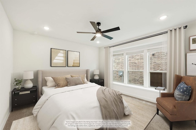 carpeted bedroom featuring ceiling fan