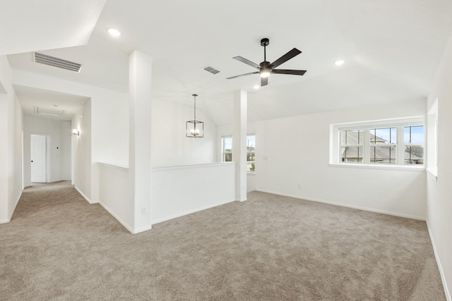 interior space with vaulted ceiling, a healthy amount of sunlight, and ceiling fan