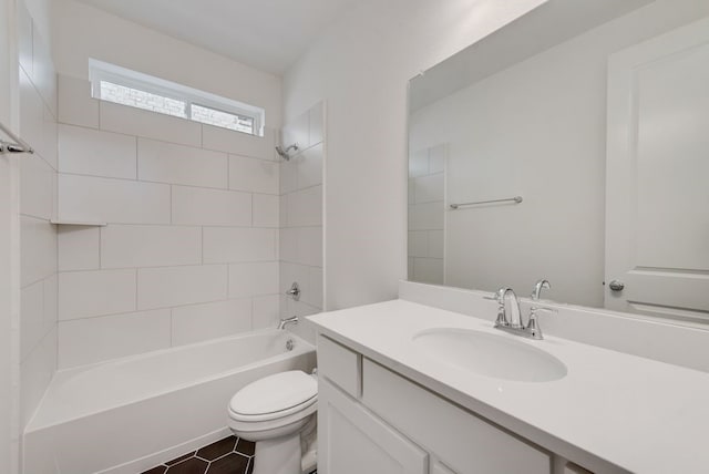 full bathroom with toilet, tile patterned flooring, tiled shower / bath combo, and vanity