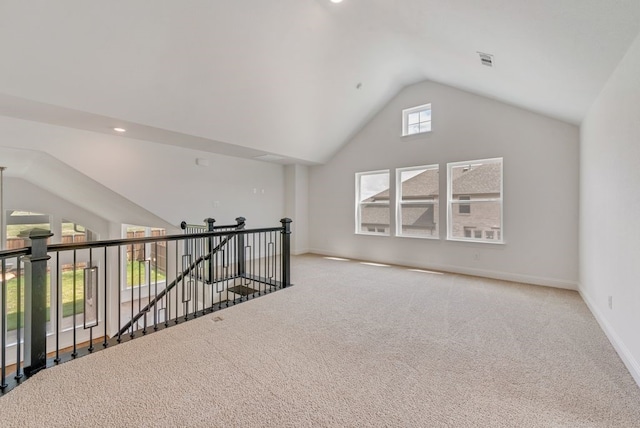 additional living space with carpet and lofted ceiling