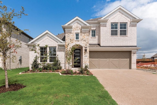 view of front of home featuring driveway, a garage, a front lawn, and brick siding