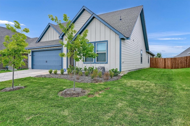 view of front of property with a garage and a front yard