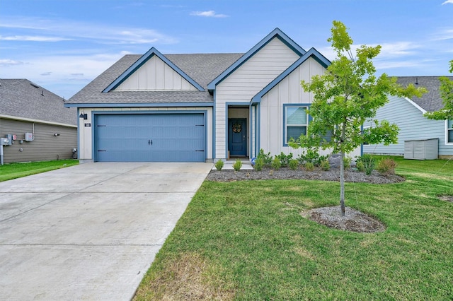 view of front of house featuring a garage and a front lawn