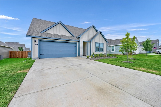 view of front of house with a front yard and a garage