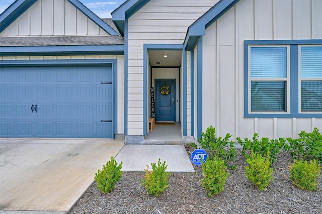 view of exterior entry featuring a garage