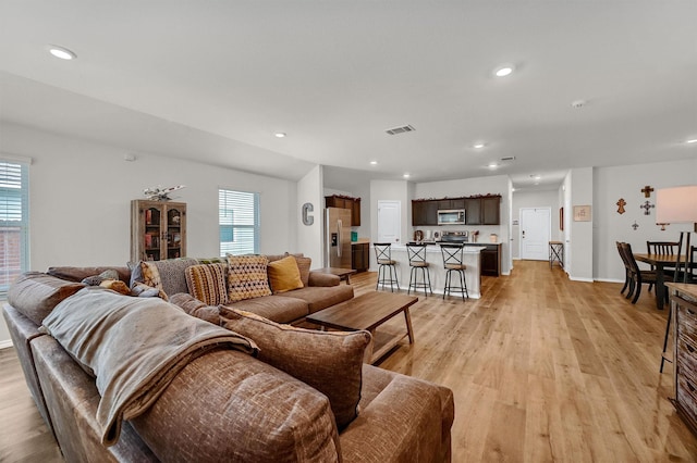 living room with light hardwood / wood-style floors