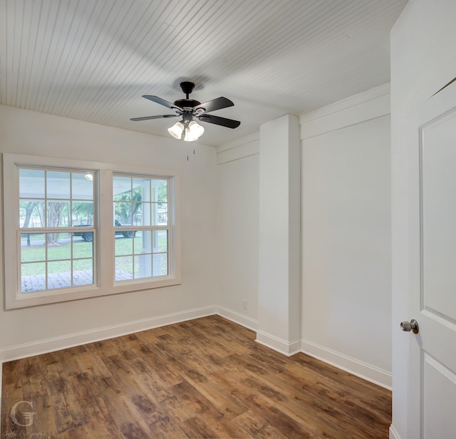 empty room featuring dark hardwood / wood-style floors and ceiling fan