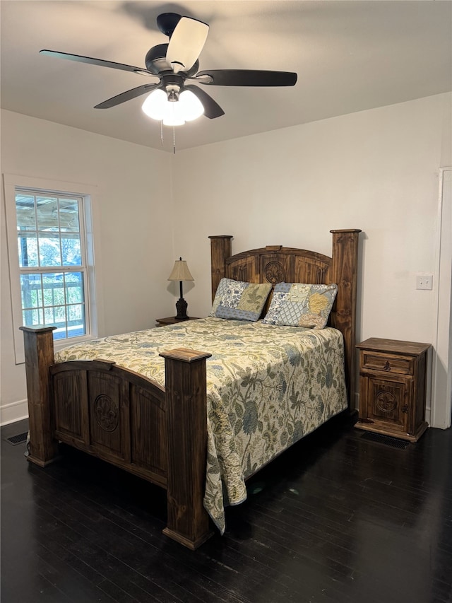 bedroom with dark wood-type flooring and ceiling fan