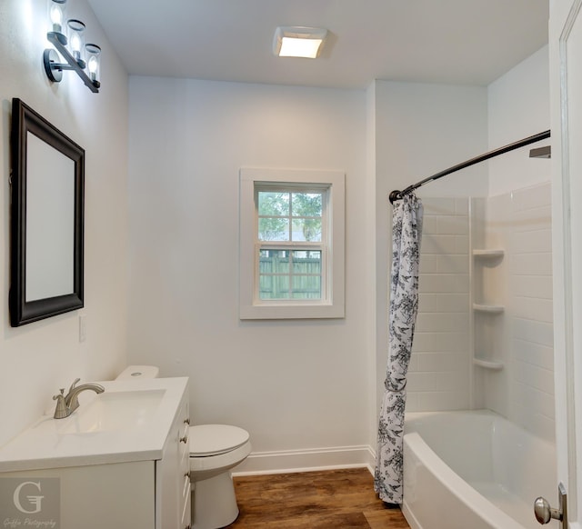 full bathroom with hardwood / wood-style floors, vanity, toilet, and shower / bathtub combination with curtain