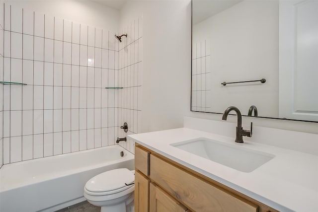 full bathroom with vanity, toilet, and tiled shower / bath