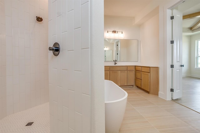 bathroom featuring tile patterned flooring, vanity, and shower with separate bathtub