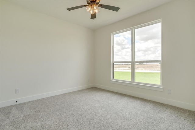 spare room with carpet flooring and ceiling fan