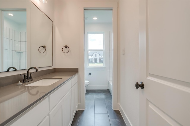 full bathroom featuring vanity, toilet, bathtub / shower combination, and tile patterned floors