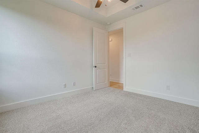 carpeted empty room with ceiling fan