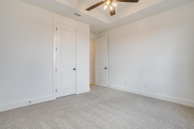 interior space with ceiling fan and light carpet